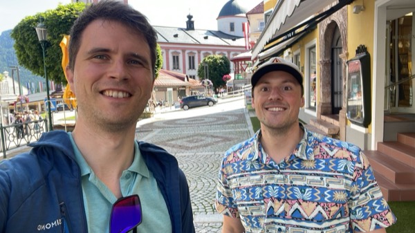 Two lab members on a village street during a lab retreat