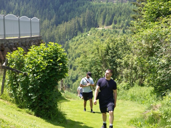 Walking up a hillside path on the retreat hike