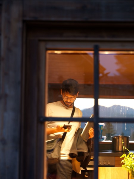 A quiet moment framed by a chalet window